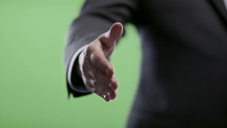 handshake from businessman on green screen.