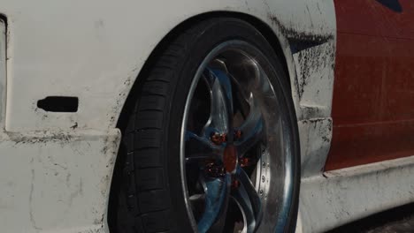 close up of a modified car wheel after drifting in the snow