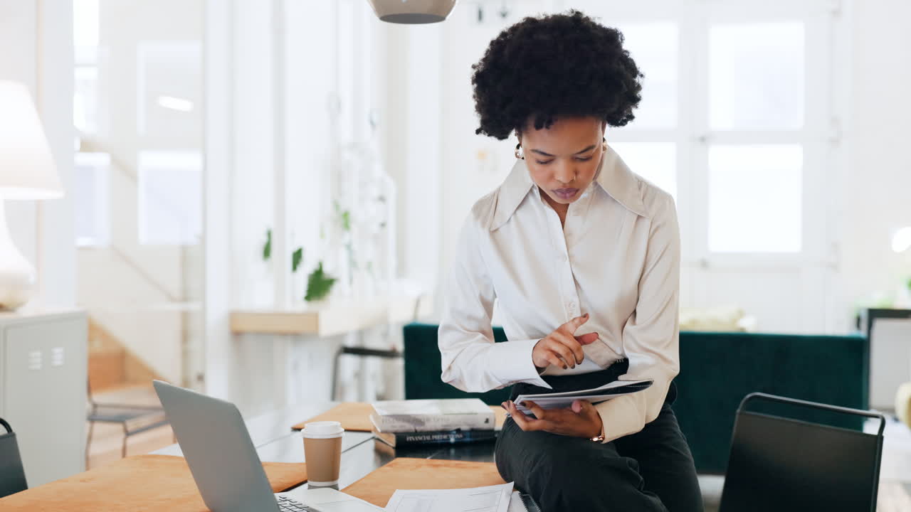 Black woman, laptop and documents in planning