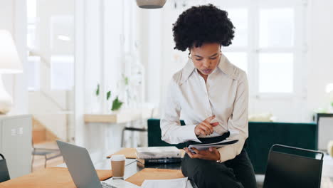 Black-woman,-laptop-and-documents-in-planning