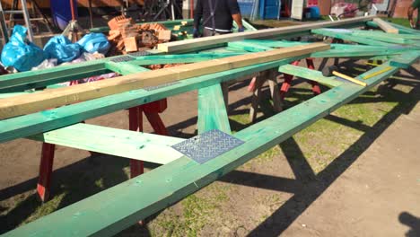 prefabricated green roof trusses laid out outdoors at construction site