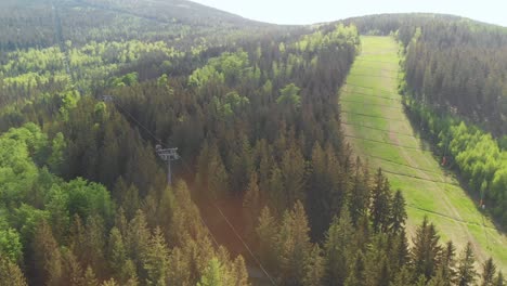 aerial orbit over the slope converted to the mountain bike trail in the woods