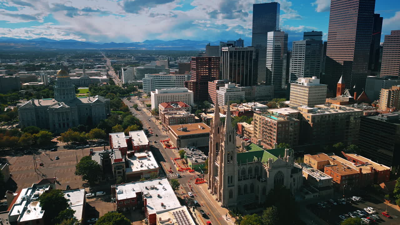 Denver, USA, 28 July 2025: Stunning panorama of modern Denver, Colorado, USA. Cathedral Basilica of the Immaculate Conception in the center