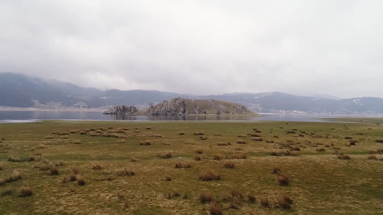 flying with drone above the lake