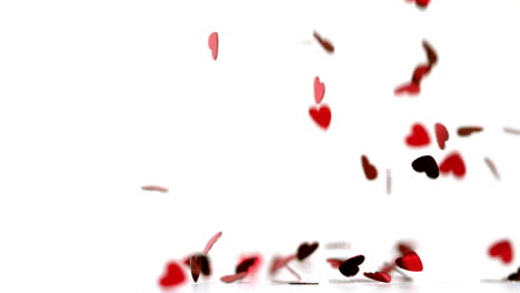 many red heart confettis falling down