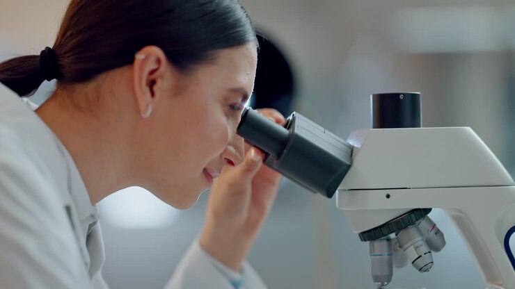 Science, research and happy woman with microscope