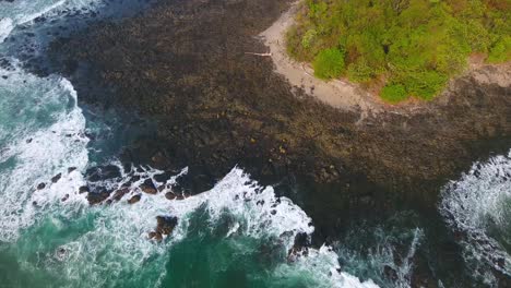 a drone shooting an overhead aerial shot of the coastline at piedra point on the nicoya peninsula in costa rica