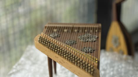 close up shot of miniature musical instrument harp rotating in place as decoration