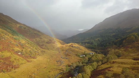 Railbow-lands-on-peaceful-country-homes,-Finnan-River-valley,-Scotland