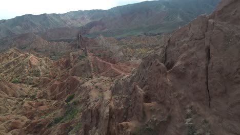 aerial establishing shot of a hiker walking towards the fairy tale canyon