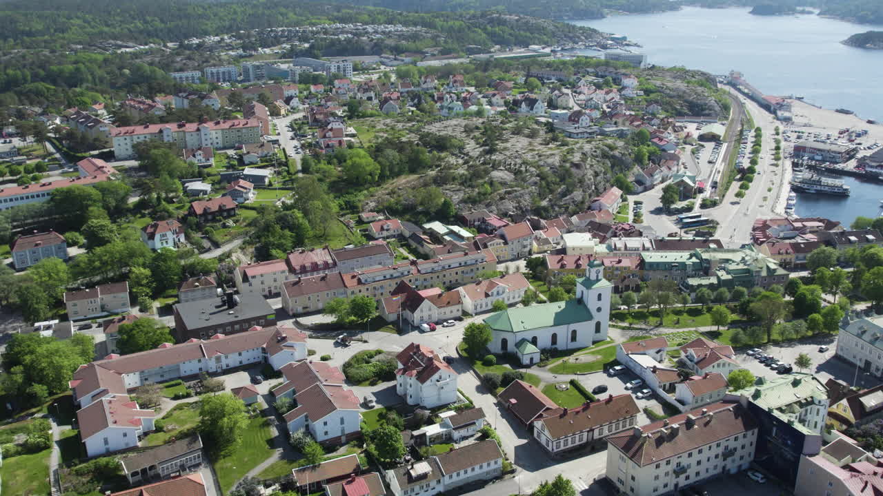 Aerial View of a Town with Buildings, Church, and Green Space