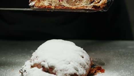 chef slices a traditional christmas stollen