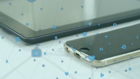 Animation of network of digital icons against close up of smartwatch, smartphone and digital tablet