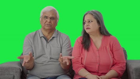 Indian-old-couple-talking-to-someone-Green-screen