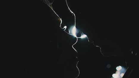 silhouettes of amorous young couple looking at each other