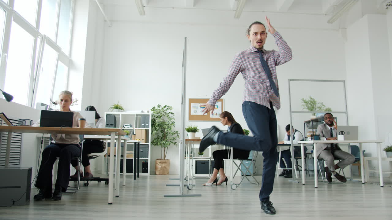 Man Dancing in Modern Office