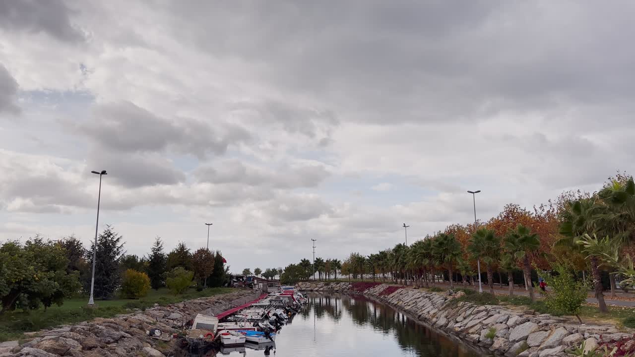 Tree-lined canal in the city in autumn.