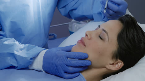 patient and surgeon during a cosmetic procedure