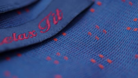 close-up of blue fabric with relax embroidery