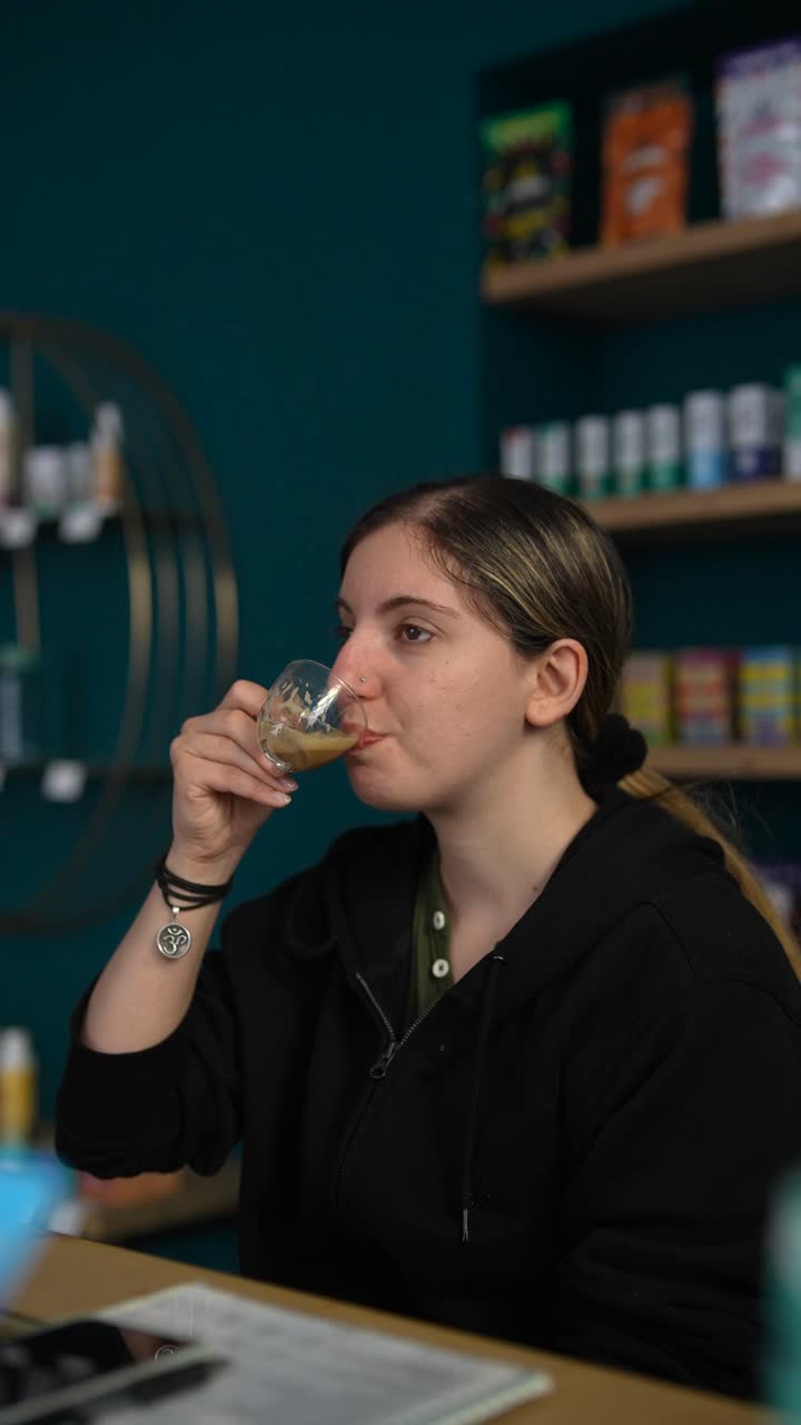 Woman drinking coffee in a cafe