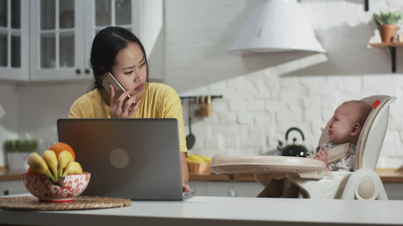 Working Mother with Crying Baby
