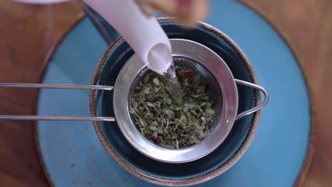 pouring natural herbal tea