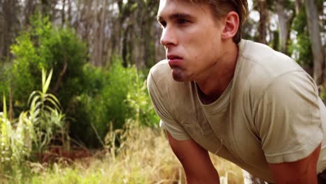 military soldier standing at boot camp during obstacle course 4k