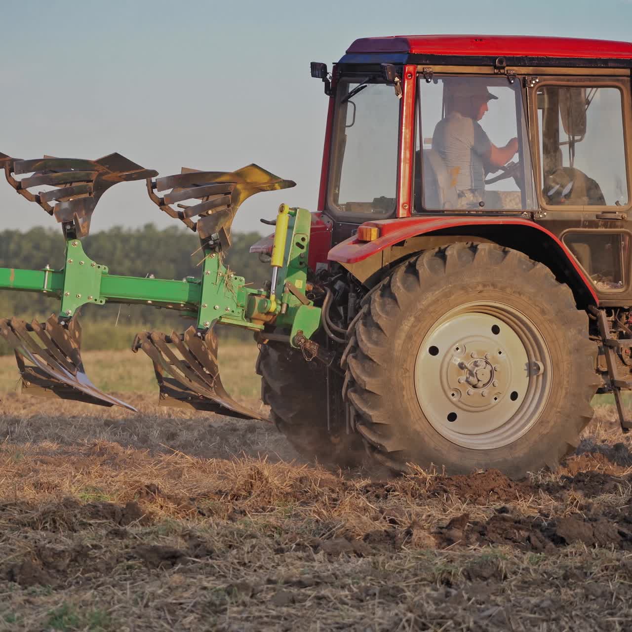 Tractor plowing land
