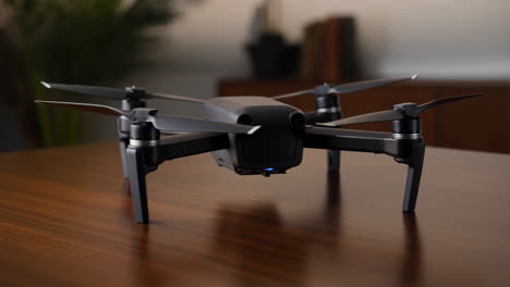 modern black drone on a wooden table