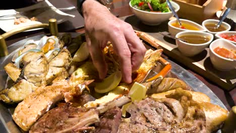 hand arranging food on a large platter