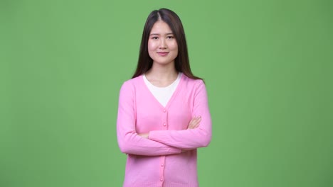 young beautiful asian woman with arms crossed