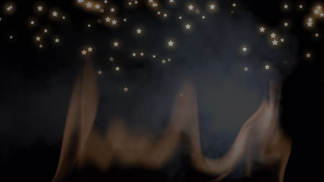 animación de estrellas de navidad cayendo sobre el humo en fondo negro
