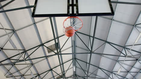 african american basketball player scores a basket