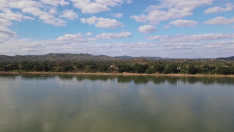 subtle movement of the mekong river and the clouds over laos as seen from thailand side