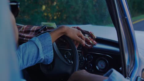 Young-man-on-a-road-trip-in-pick-up-truck