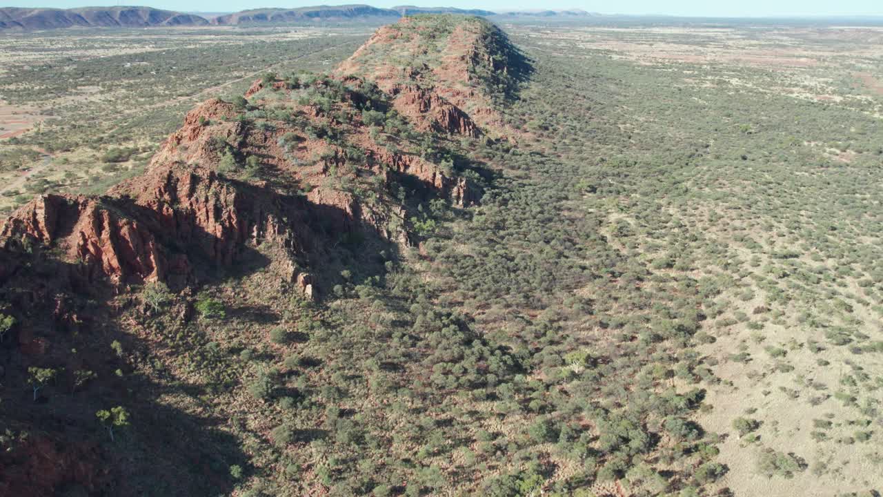 Aerial footage along the MacDonnell Ranges near Roe Creek, in the Northern Territory, Australia. August 2022.