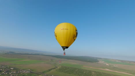 hot air balloon over rural landscape