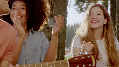 friends singing and playing guitar