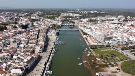 tavira algarve portugal drone shot up the galao river from the fishing harbour in the town