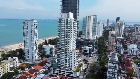 Towering-above-neighbouring-skyscrapers,-Marriott-Residences-Penang