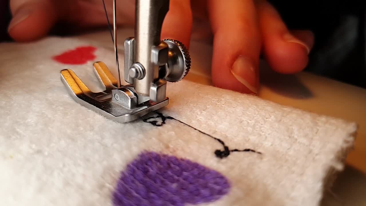 Making heart pattern with thread on a sewing machine with love