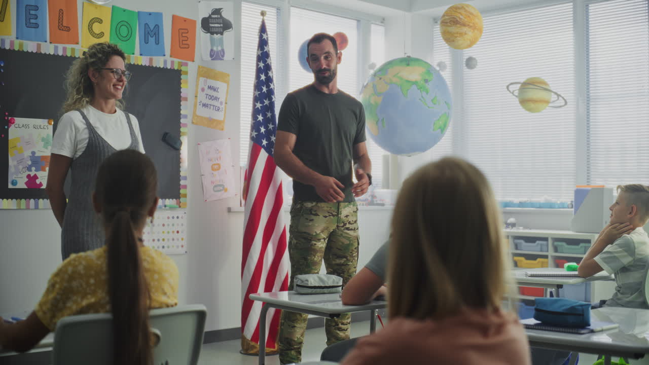 American Military Man Giving Lecture to Curious Primary School Students About Discipline and Army
