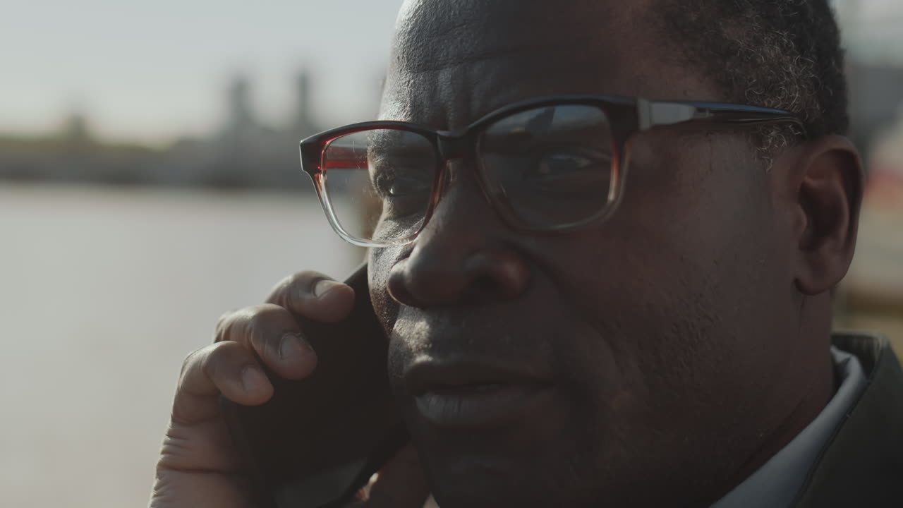 African American Man Having Phone Talk Outdoors
