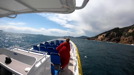 a motorboat travels at high speed along the australian coastline