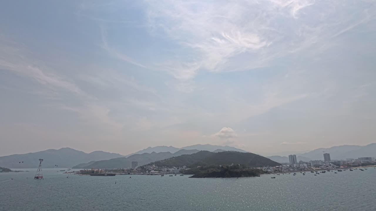 Coastal Cityscape with Mountains