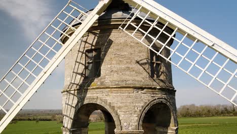 chesterton white stone cylinder domed tower windmill rising aerial view above rural countryside landmark