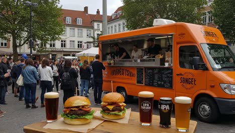 delicious burgers and refreshing drinks captured at a food truck event, showcasing a vibrant atmosphere of social gatherings and culinary delights