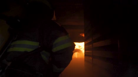 slow motion reveal of brave firefighters battling a blaze in a building