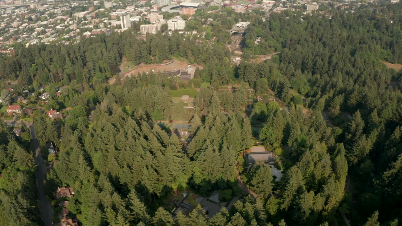 Pan up reveal aerial shot of Portland Oregon from forest park
