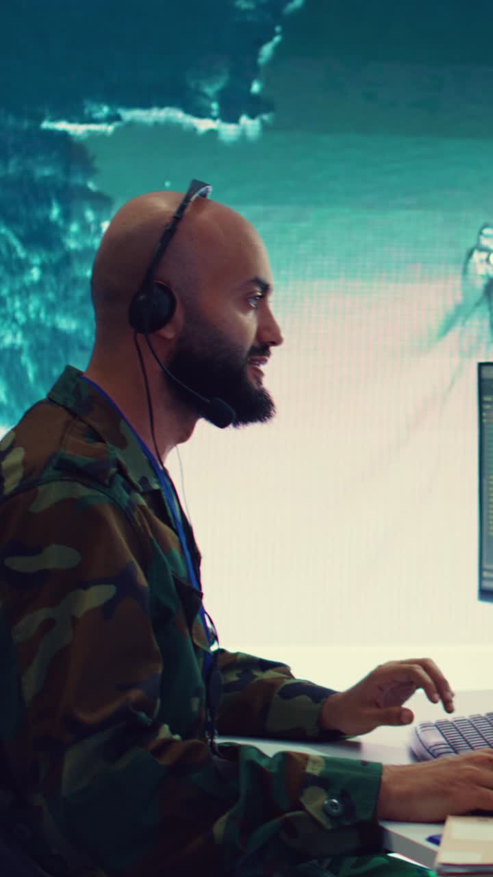 Man in Headset Communicating and Typing on Computer